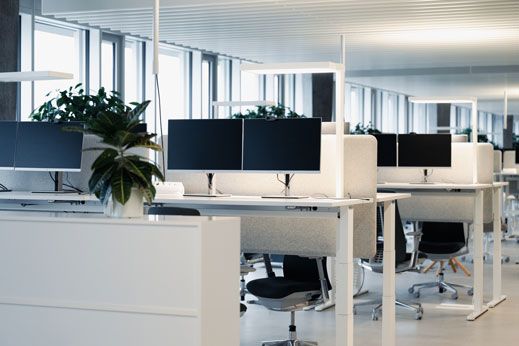 Modern, bright workstations in an open-plan office.